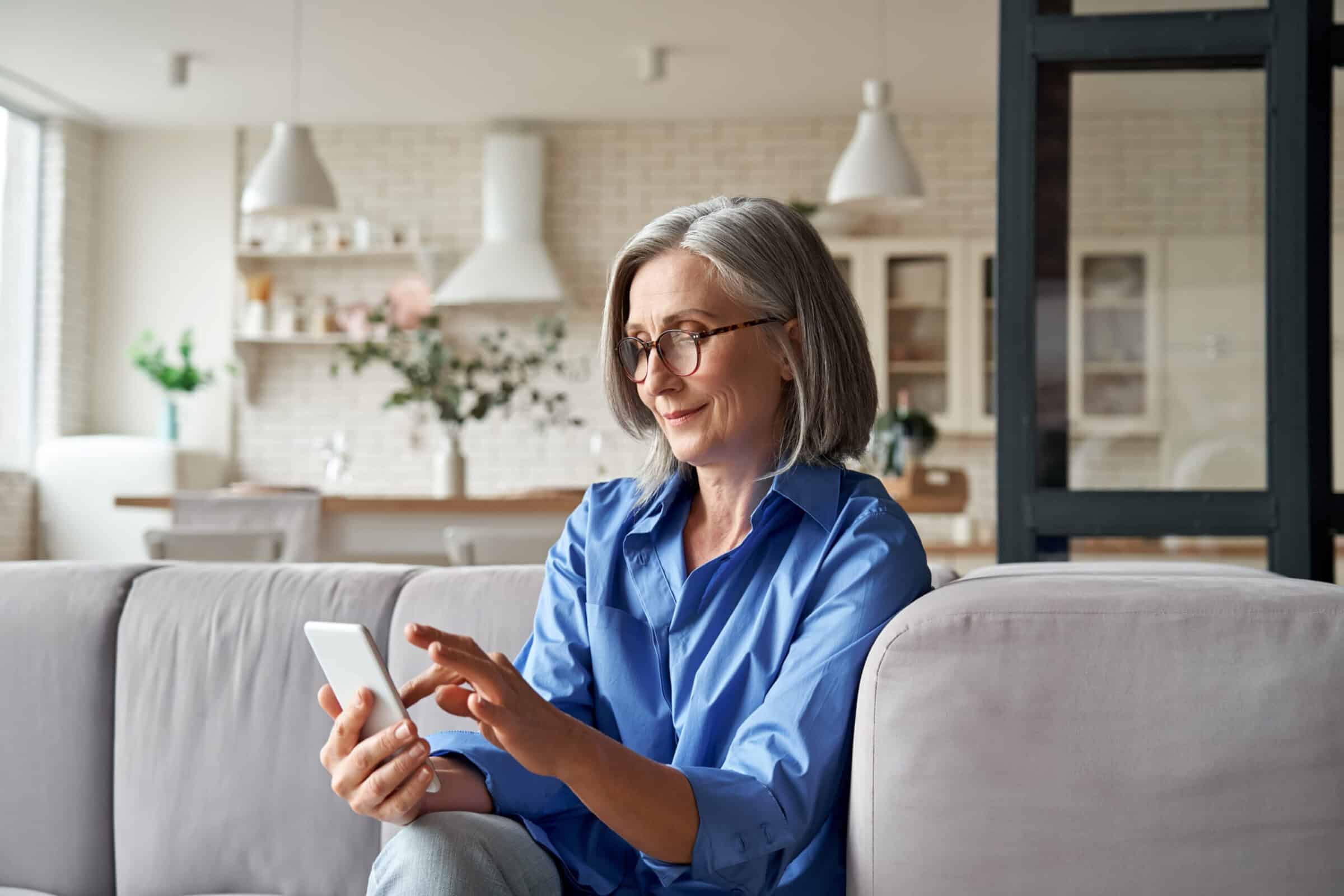 older woman checking mobile patient portal